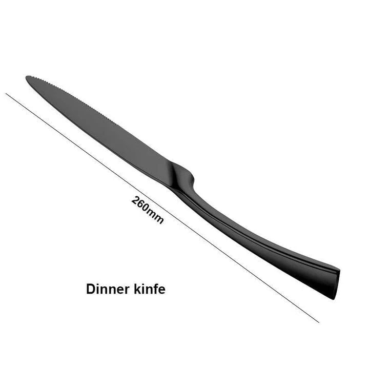 A stylish set of black stainless steel flatware, including a teaspoon, knife, and fork, on a white background.