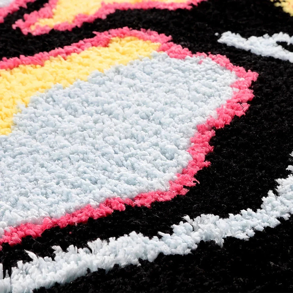 A stylish, black and pink skull-patterned area rug with an irregular, funky design for a modern living room or bedroom