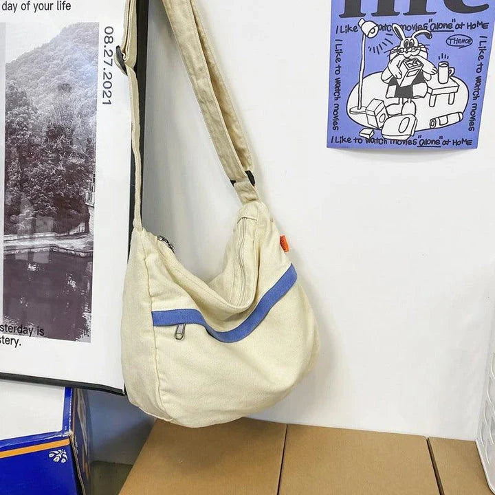 A stylish and durable canvas tote bag with a spacious interior and a timeless vintage-inspired design, perfect for everyday use and travel