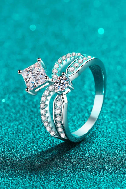 Elegant sterling silver ring with a moissanite centre stone and zircon accents, featuring a modern and minimalist crown design