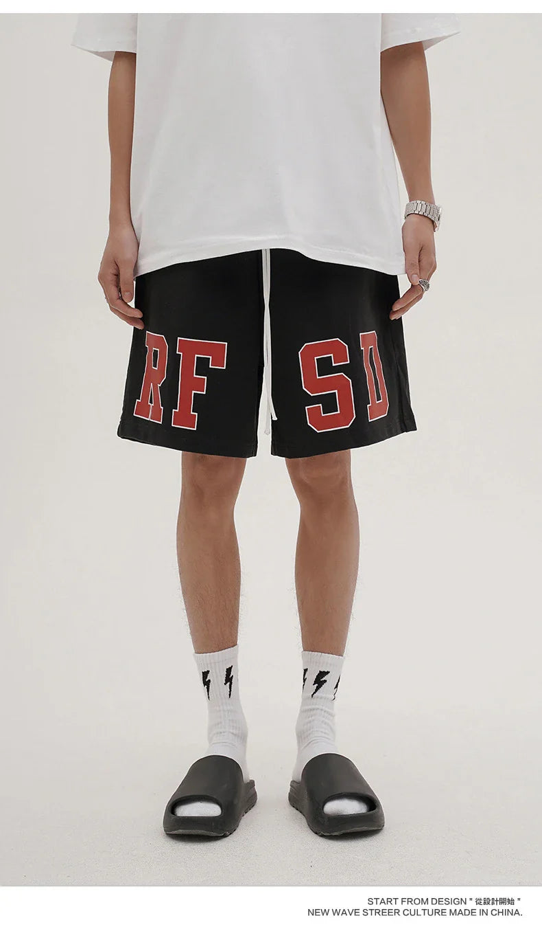 Premium loose-fit sports shorts with eye-catching printed patterns in black, khaki, and dark grey colours