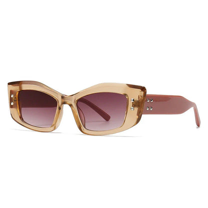 Retro cat eye sunglasses with rivet details, offering a stylish and protective eyewear solution.