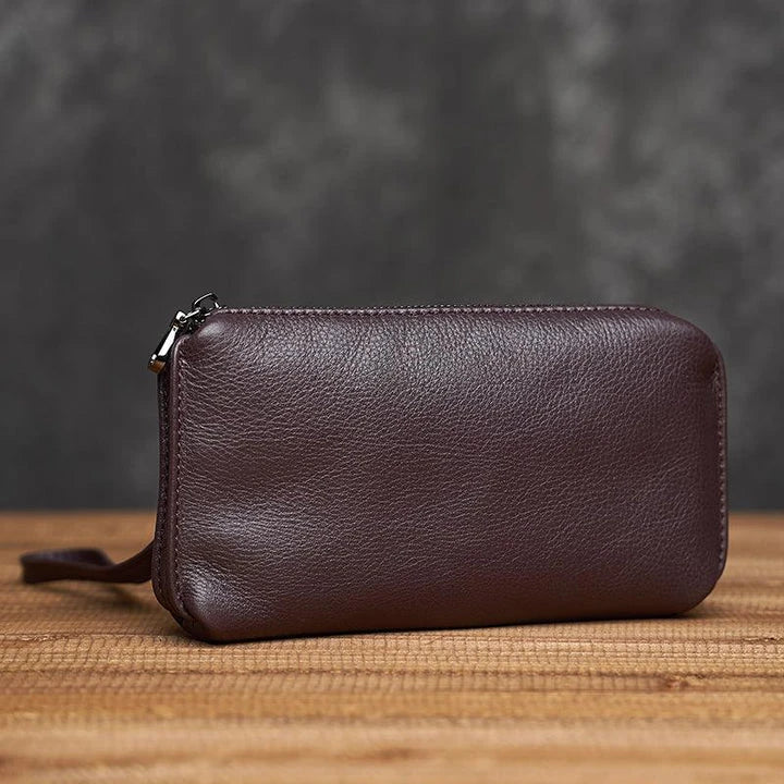 Premium genuine leather handbag in a sleek, contemporary design with secure zipper closure and internal organisation pockets