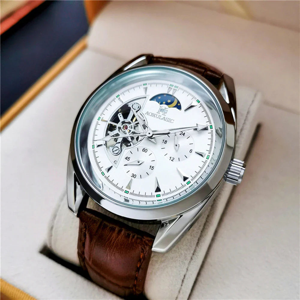 Elegant men's automatic mechanical watch with exquisite hollowed-out design, featuring luminous hands, moon phase display, and small seconds subdial.