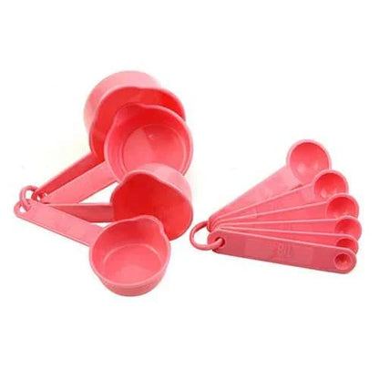 A set of 10 pink baking measurement cups and spoons made from food-grade plastic for precise ingredient measurements
