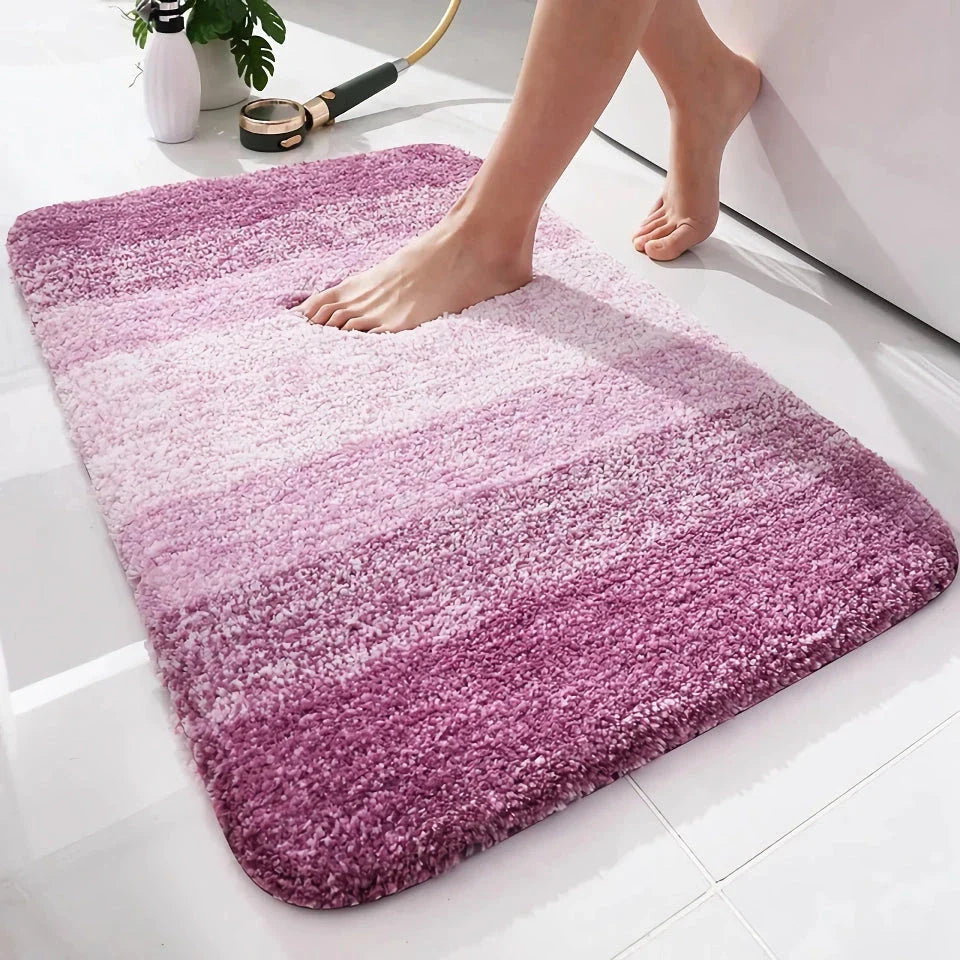 Luxurious microfibre absorbent bath mat with soft, plush texture and non-slip rubber backing for comfort and safety in the bathroom
