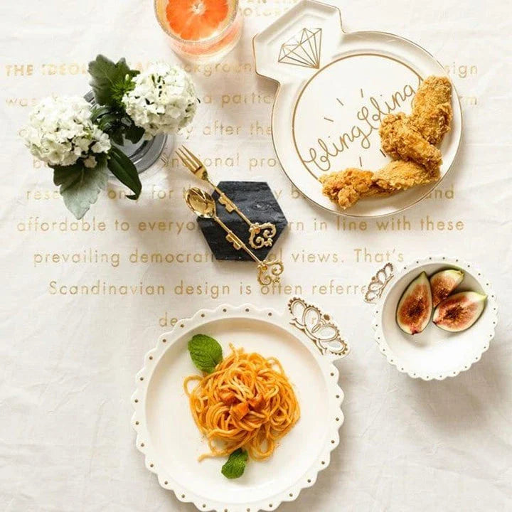 Elegant diamond ring-inspired porcelain dinnerware set with plate, bowl, and cup in a minimalist white colour