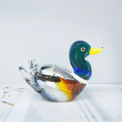 Handcrafted glass ornament in the shape of a Mandarin duck with vibrant colours and intricate details