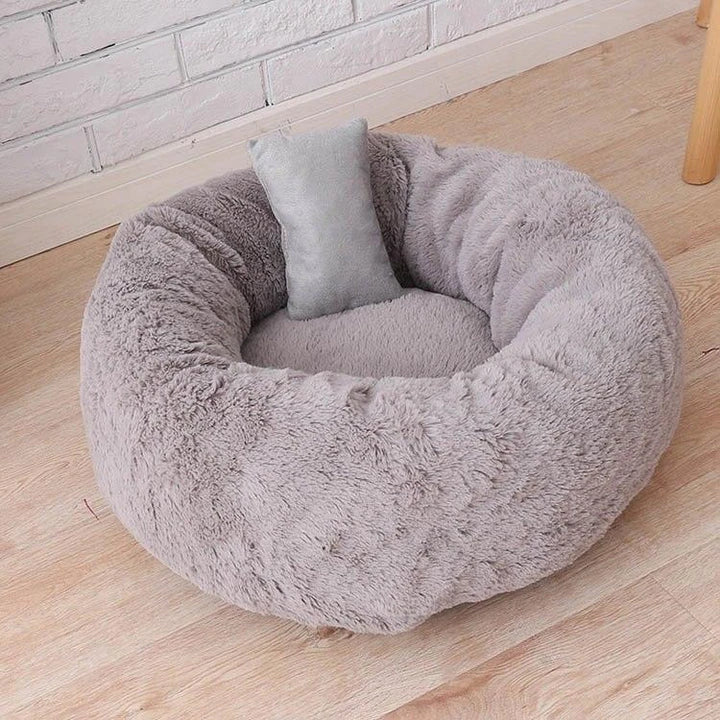 Cosy and comfortable fleece round cat bed in pink colour, perfect for your beloved feline friend to relax and unwind.