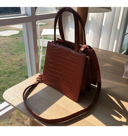 Retro one-shoulder messenger bag for women, made with premium PU materials and featuring a classic vintage-inspired design.