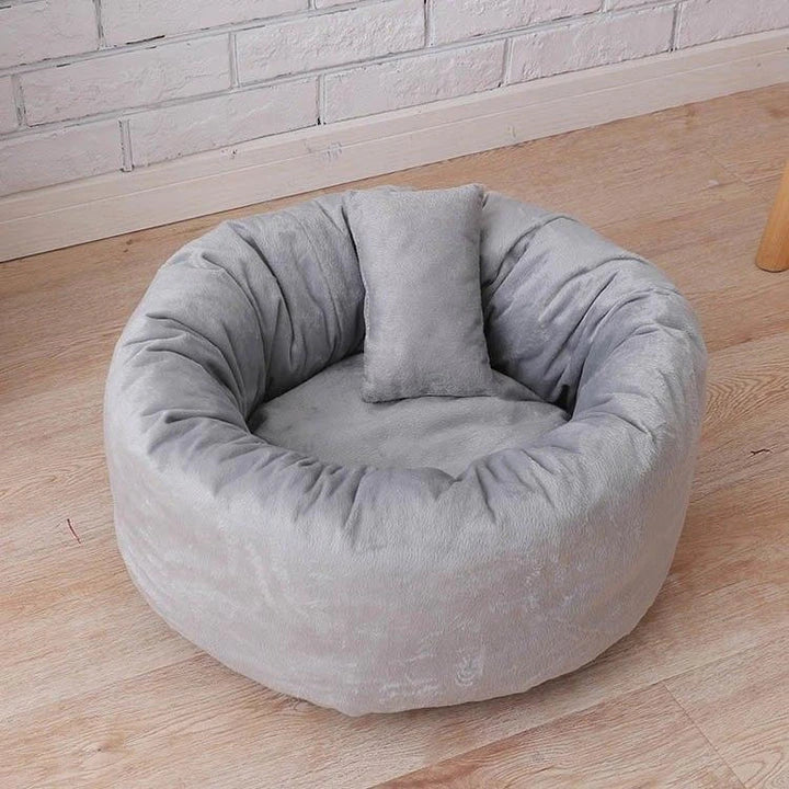 Cosy and comfortable fleece round cat bed in pink colour, perfect for your beloved feline friend to relax and unwind.