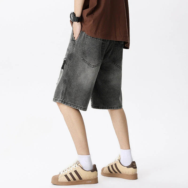 Premium British-crafted vintage-inspired ripped denim shorts for men with a straight-leg silhouette and authentic distressed details
