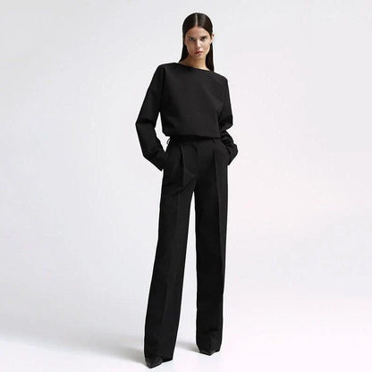 Elegant and sophisticated women's two-piece office suit with long sleeve top and wide-leg pants in a neutral colour palette
