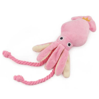 A soft, plush pink squid-shaped dog toy with a vibrant and whimsical design