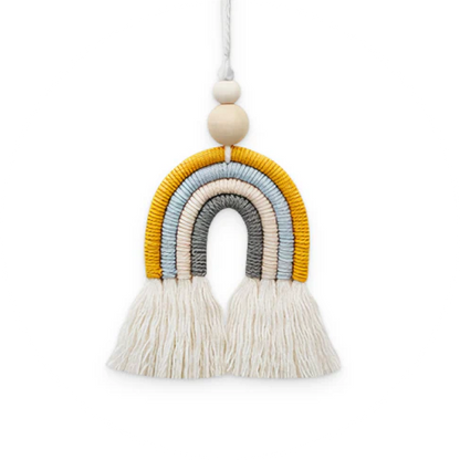Bohemian-inspired cotton rainbow charm with wooden beads and tassels, a calming and cheerful home decor accent piece
