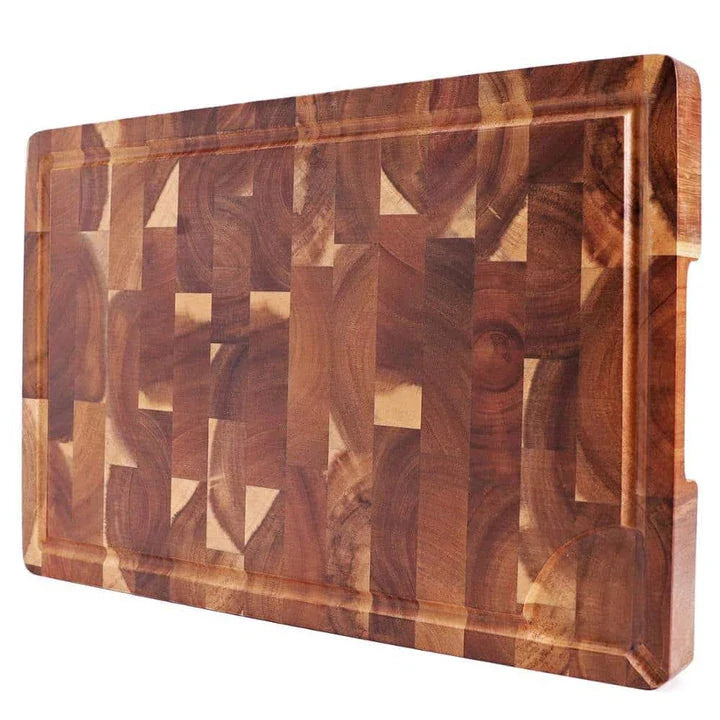 Premium Acacia wood chopping board with a convenient juice groove to catch liquids during food preparation