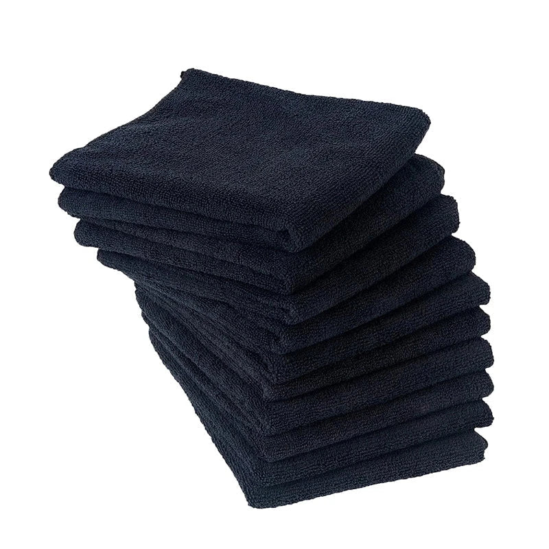 Premium microfibre salon towels in black, featuring a large size, lightweight and highly absorbent design for efficient hair drying