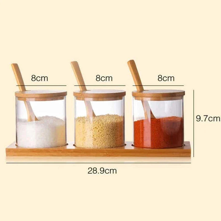 Elegant glass canister with wooden spoon, a versatile kitchen accessory for storing and displaying pantry items