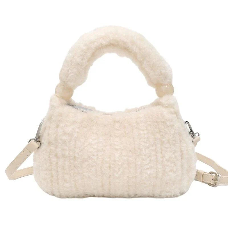 A luxurious faux fur hobo handbag with a stylish baguette shape and secure zipper closure