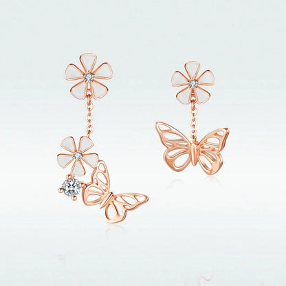 Pair of silver earrings featuring a butterfly-shaped floral design with sparkling white crystals, inspired by the enchanting Forest Series