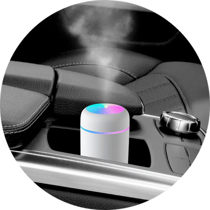 Compact in-car LED humidifier with rainbow mood lighting, designed to freshen and relax your vehicle's interior