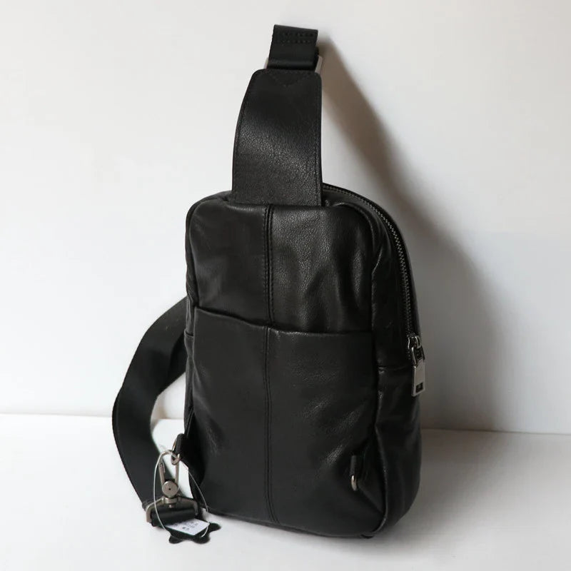 A high-quality leather chest bag in a vertical design, perfect for outdoor activities and adventures.