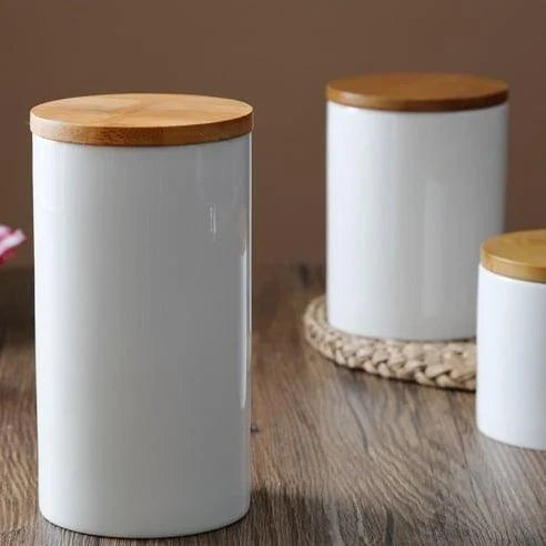 A ceramic kitchen jar with a bamboo lid, available in three sizes to suit your storage needs