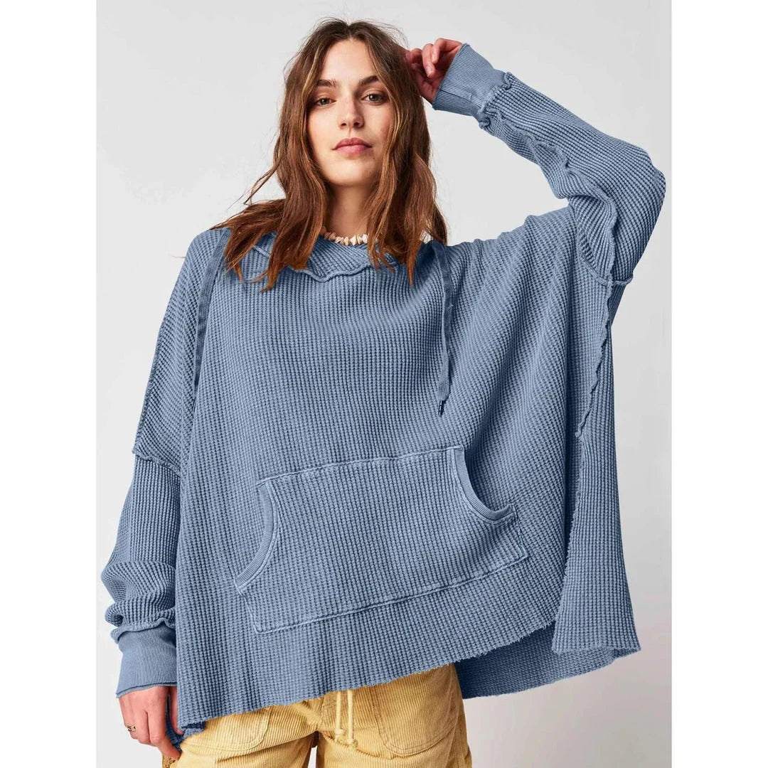 Cosy and stylish oversized hoodie with practical pockets for women, available in black, charcoal grey, and navy blue