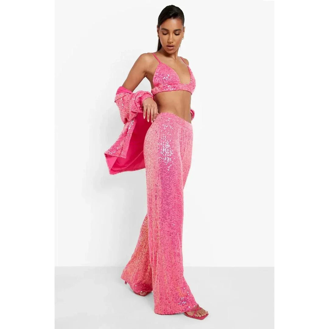 Elegant woman wearing a luxurious sequin top and pants set, perfect for a glamorous evening event
