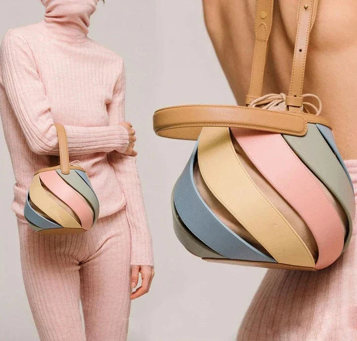Stylish striped PU leather bucket handbag with versatile carry options and roomy interior