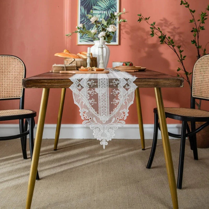 Elegant lace table runner with intricate embroidery and hollowed-out patterns, adding sophistication to any dining setting
