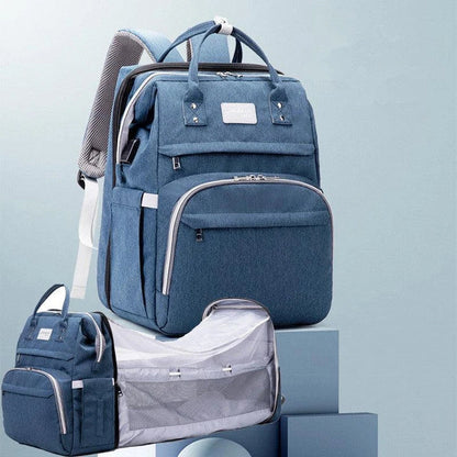 Multifunctional maternity diaper backpack with removable mosquito net, foldable crib, and water-resistant design for convenient family travel
