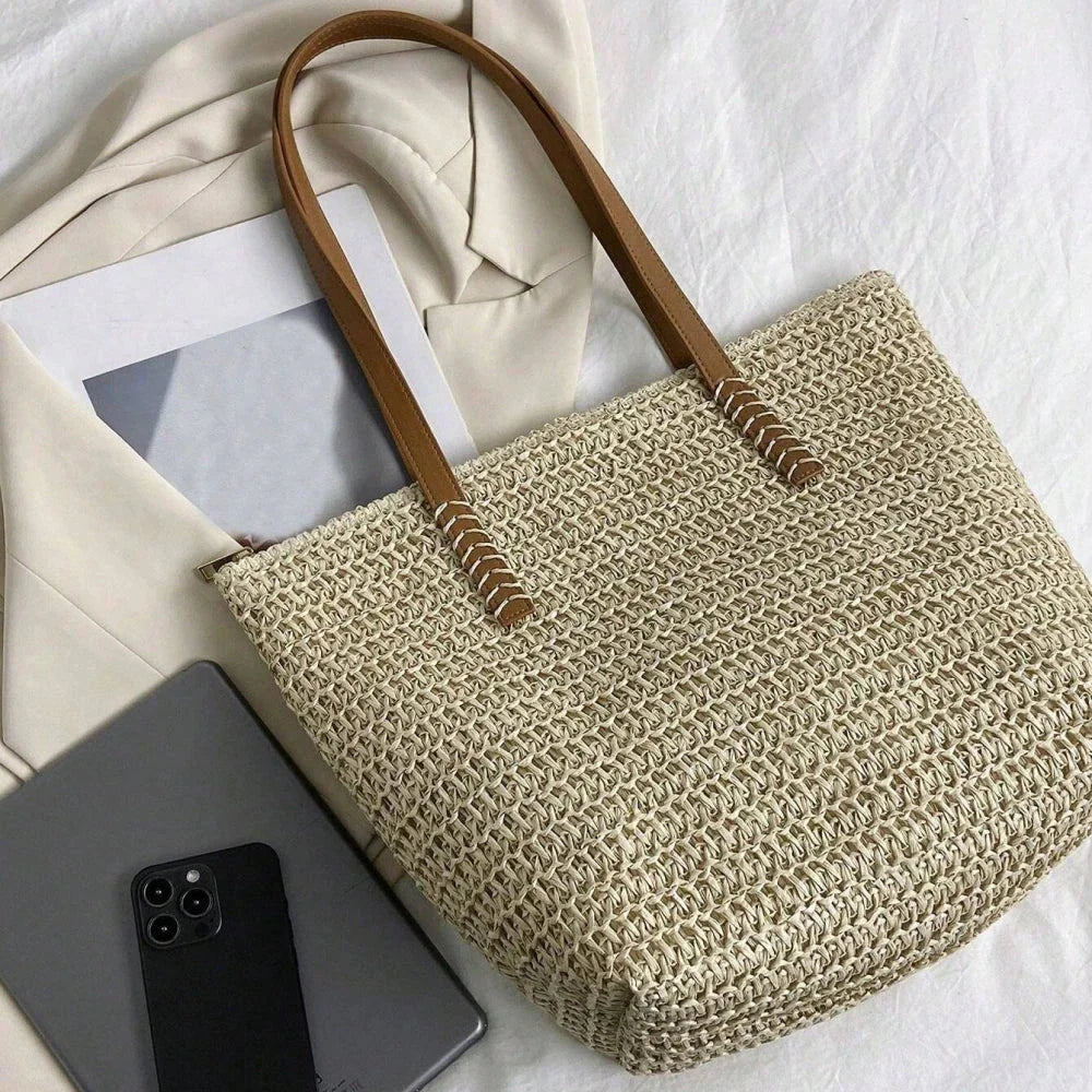 Elegant handcrafted woven straw tote bag in beige colour, perfect for summer outings and carrying essentials