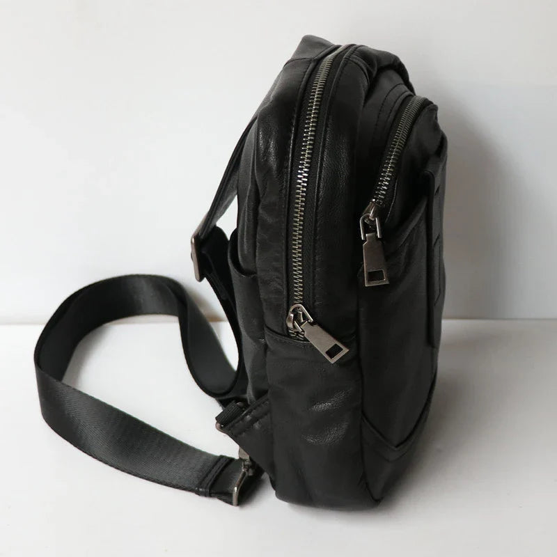 A high-quality leather chest bag in a vertical design, perfect for outdoor activities and adventures.