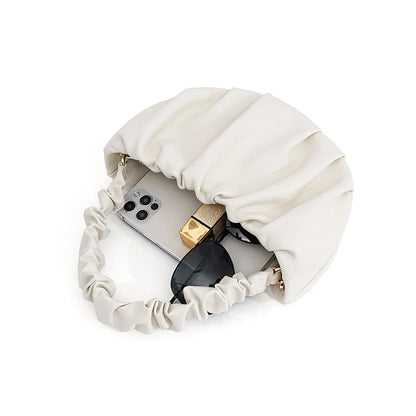 Luxurious sheepskin pleated crossbody bag in various colours, featuring a chic and contemporary design perfect for any occasion.