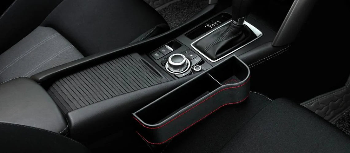 Premium multifunctional car seat organiser with various compartments for storing phones, chargers, pens, and other car essentials