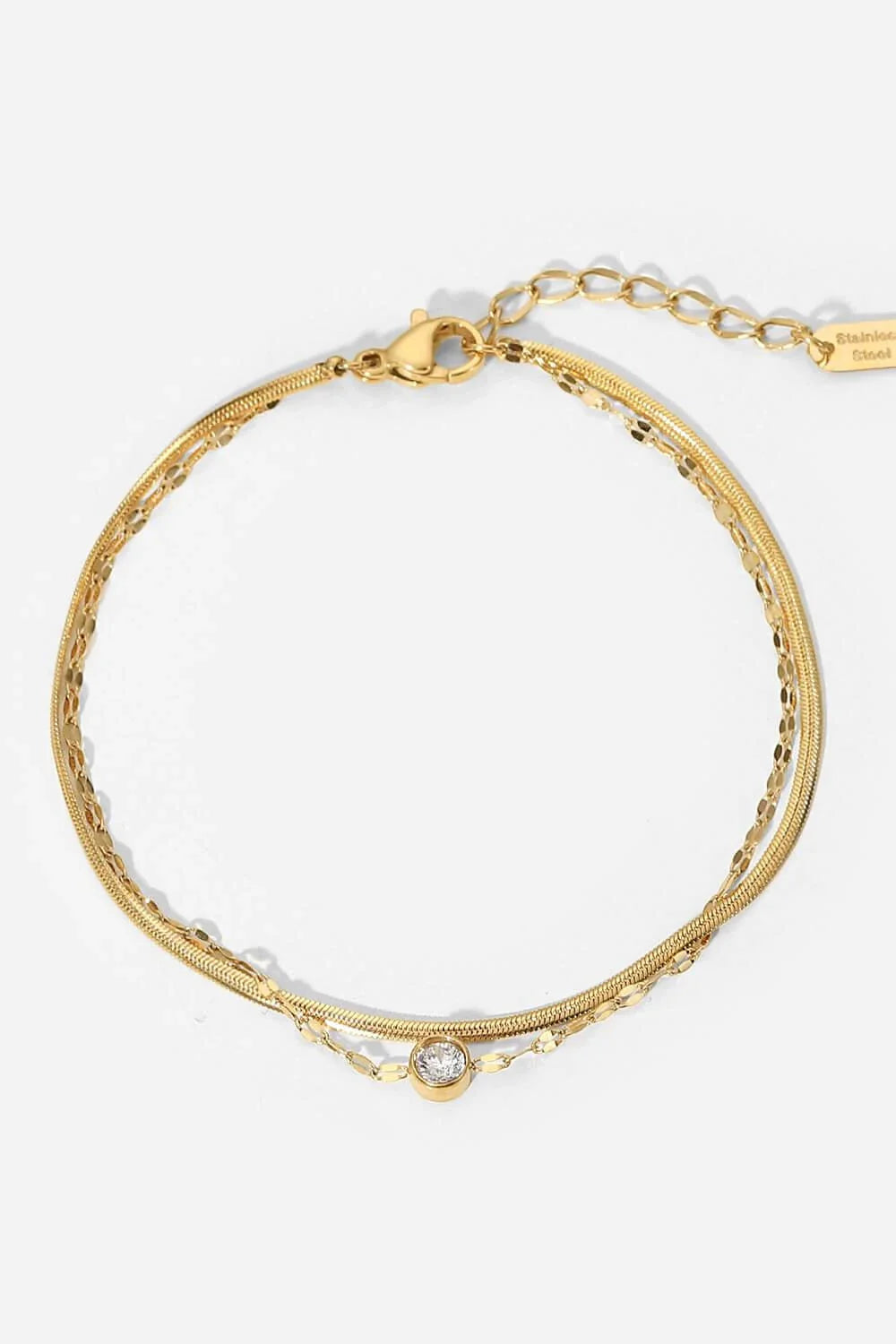 Exquisite rhinestone double-layered bracelet in gold finish, a premium stainless steel accessory with an adjustable design for a customised fit.
