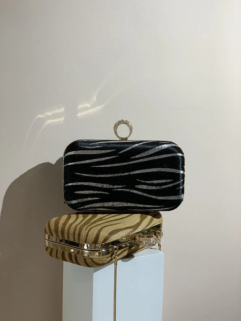 A premium handcrafted messenger bag made with luxurious horsehair and featuring a unique colourful brick ring buckle closure, showcasing the timeless charm of British craftsmanship.