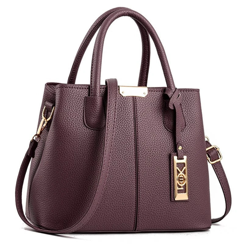 A stylish one-shoulder tote bag in various colours, made of premium polyester with an adjustable strap and spacious interior for the modern professional woman.