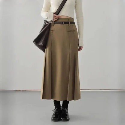 Elegant high-waisted pleated a-line skirt with a flattering silhouette and practical pockets, ideal for autumn and winter in the UK