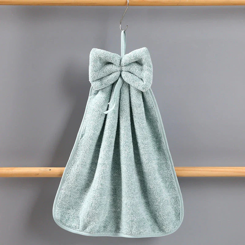 Elegant coral fleece hand towels with a unique bow design, perfect for kitchen and bathroom use