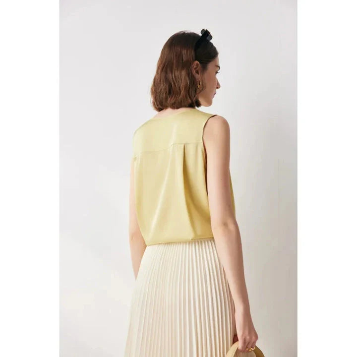 Elegant sleeveless silk blouse in a vibrant blue colour, designed for a sophisticated summer style