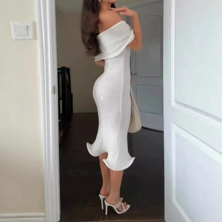 Chic white sleeveless dress with slim-fit silhouette, perfect for stylish occasions in the UK