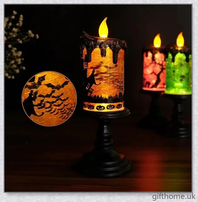 Candlite 10-inch Grand Glittering Halloween LED Candles with intricate designs of spiders, skulls, and other spooky elements