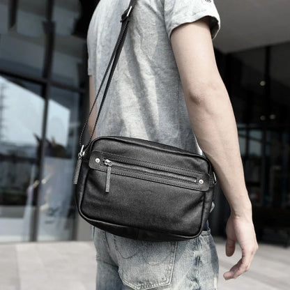 A premium British leather shoulder bag with a sleek, minimalist design and adjustable strap