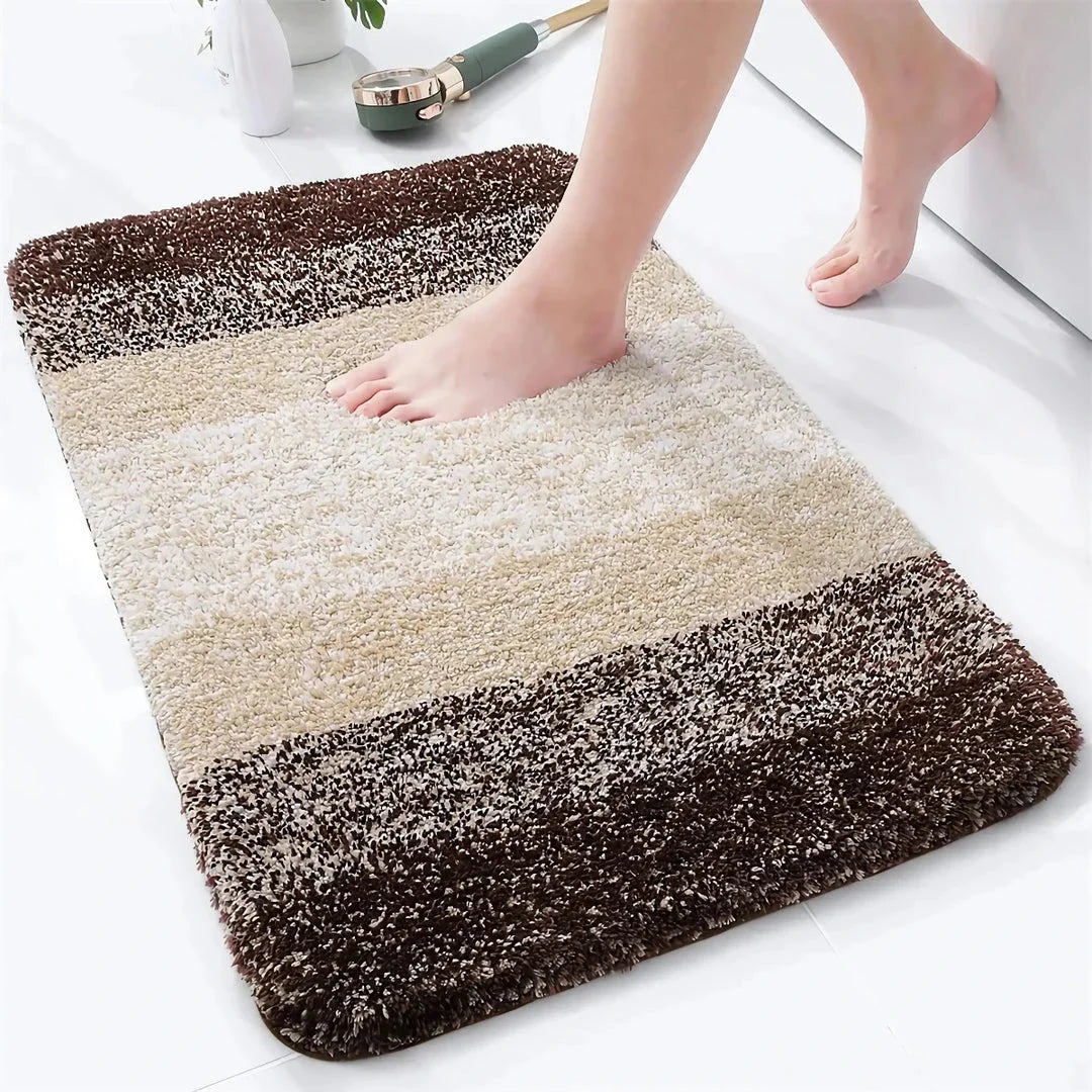 Luxurious microfibre absorbent bath mat with soft, plush texture and non-slip rubber backing for comfort and safety in the bathroom