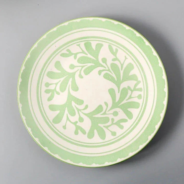 Elegant ceramic plates with vibrant, whimsical prints in a variety of enchanting designs