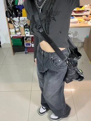 Women's high-waist, wide-leg black denim jeans with multiple pockets and vintage-inspired wash