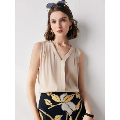 Elegant sleeveless silk blouse in a vibrant blue colour, designed for a sophisticated summer style