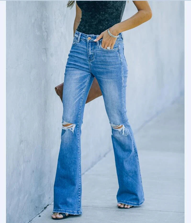 Premium distressed denim trousers for British women, featuring a high-waist silhouette and subtle ripped detailing